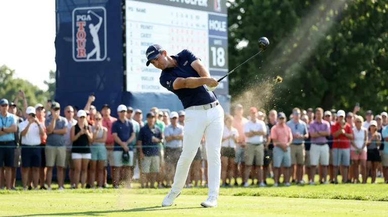 Golfer mid-swing during a competitive round showing peak form
